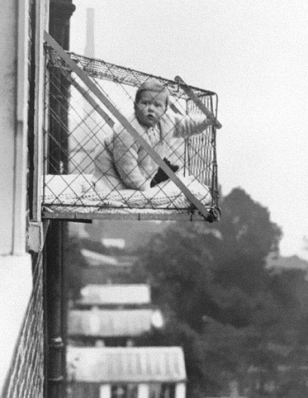 Baby-cages-used-to-ensure-that-children-get-enough-sunlight-and-fresh-air-when-living-in-an-apartment-building-ca-1937